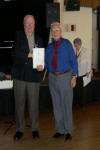 Bill Elks presents new judge Ralph Carver with his judge's certificate